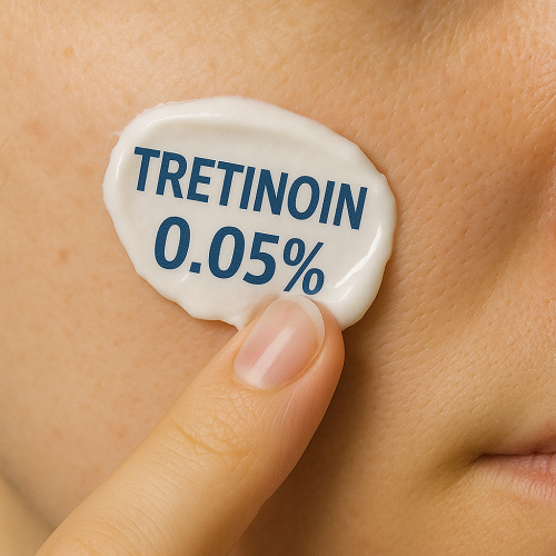 Applying Tretinoin 0.05% cream on the skin with a fingertip