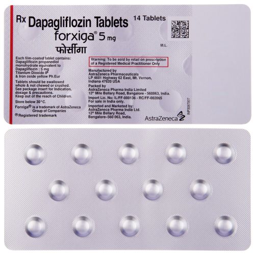 Forxiga 5mg blister strip close-up, tablets and printed label details legible